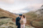 Winter Lake District Elopement at Moss Force, bride has a dried bouquet